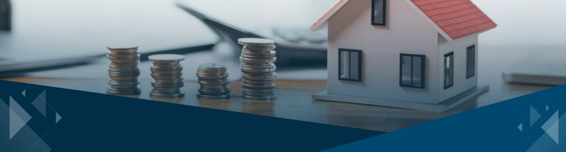 Model house with stacked coins representing the tax-free rental income opportunity under the Augusta Rule
