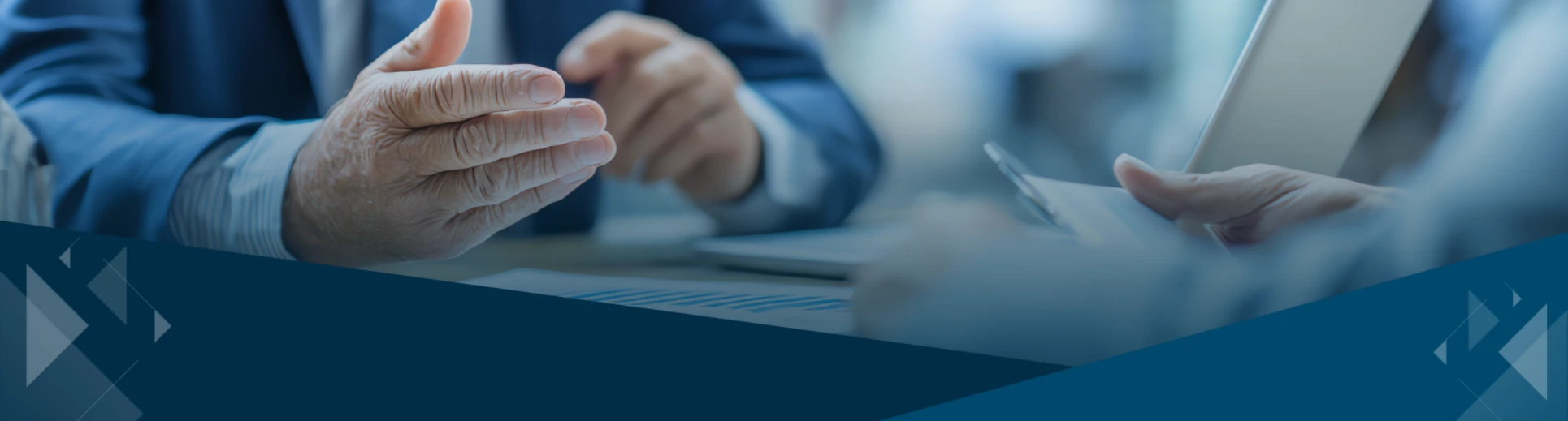 Business advisor meeting with client reviewing reports and planning exit strategy